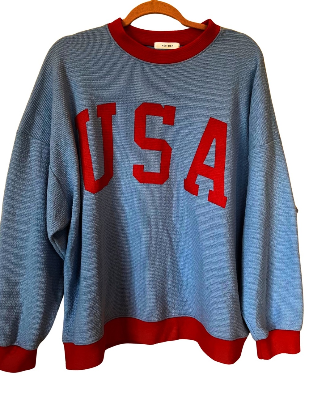Tres Bien Light Blue Crewneck Sweatshirt with Red USA Appliqué